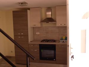 Kuchyňa alebo kuchynka v ubytovaní apartman Zdravko