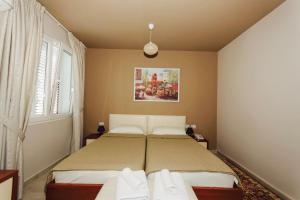 Postel nebo postele na pokoji v ubytování Vila Ada Hotel