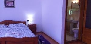 Кровать или кровати в номере Pensiunea Casa Bradet