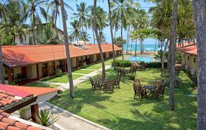 an aerial view of a resort with tables and chairs at Amagi Beach – Secluded Slice of Paradise in Marawila