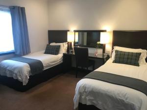 Cama o camas de una habitación en Aaron Glen Guest House