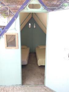 a small tent with two beds in it at Camping Koula in Parikia