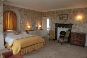 Кровать или кровати в номере Willowhill House