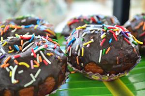 a group of chocolate covered donuts with sprinkles at Yensfield Blackpool in Nuwara Eliya