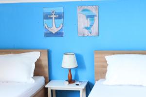 Postel nebo postele na pokoji v ubytování Apartments Jakovljevic