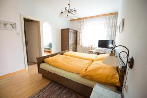Postel nebo postele na pokoji v ubytování Gasthof Speneder
