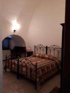 Postel nebo postele na pokoji v ubytování Masseria Cassiere