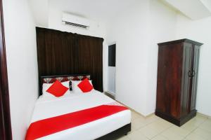 Postel nebo postele na pokoji v ubytování Green Palace Colombo
