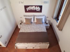 Posteľ alebo postele v izbe v ubytovaní Alloggio turistico La Casa del Vignola