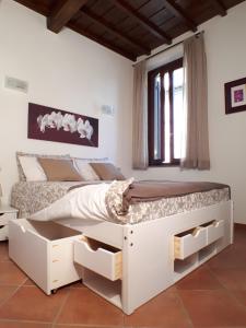 Posteľ alebo postele v izbe v ubytovaní Alloggio turistico La Casa del Vignola