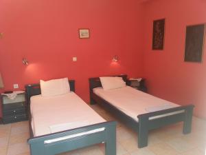 Posteľ alebo postele v izbe v ubytovaní Rigos Apartments