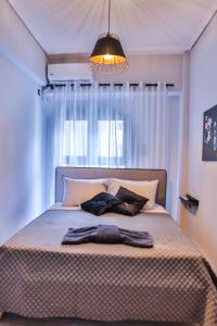 Un pat sau paturi într-o cameră la LM Luxury Central Loft