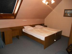 Un pat sau paturi într-o cameră la Hotel Ten Putte