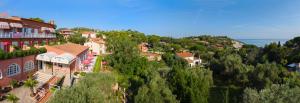 a small town on a hill with houses and trees at Hotel Acquamarina in Portoferraio