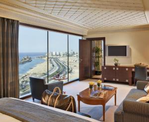 a living room with a view of the ocean at Rosewood Jeddah in Jeddah