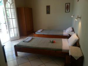 Posteľ alebo postele v izbe v ubytovaní Rigos Apartments