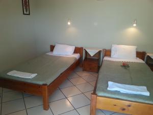 Posteľ alebo postele v izbe v ubytovaní Rigos Apartments