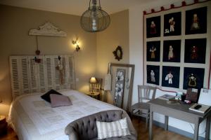 Кровать или кровати в номере Maison d'hôtes LE LAVOIR