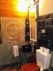 a bathroom with a toilet and a sink in it at City Apartment in Buenos Aires