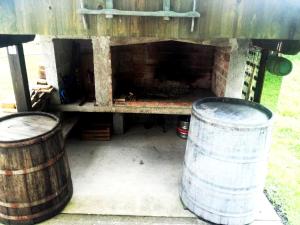 two barrels sitting in front of a truck at Apartman Nino in Tounj
