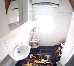 a bathroom with a sink and a toilet at Apartman Nino in Tounj +33 photos
