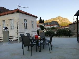 a table and chairs sitting on a patio at Matina's agora apartment with Terrace in Leonidio