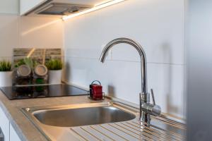Kuchyň nebo kuchyňský kout v ubytování Apartment StellaMare