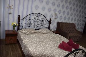 Postel nebo postele na pokoji v ubytování Voskhod Hotel