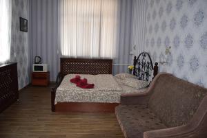 Postel nebo postele na pokoji v ubytování Voskhod Hotel