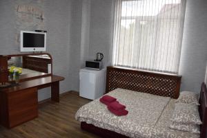 Postel nebo postele na pokoji v ubytování Voskhod Hotel