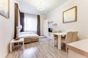 a living room with a bedroom and a dining room at Apartment Masná 21 in Prague