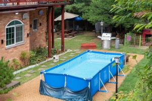 a swimming pool in the backyard of a house at The Hyu Largo in Yongin