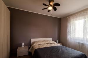 Ένα ή περισσότερα κρεβάτια σε δωμάτιο στο Casadamare Apartment