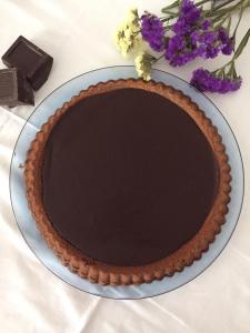 a chocolate pie on a plate with chocolate at Hotel De Rosa in Maiori