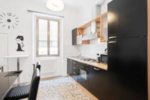 Majoituspaikan Carpe Diem Arno Apartment keittiö tai keittotila