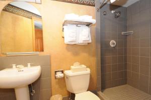 a bathroom with a toilet and a sink and a shower at Shoshone Condos at Big Sky Resort in Big Sky +23 photos