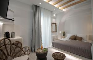 Postel nebo postele na pokoji v ubytování Majestique of Naxos luxury suites + 37 fotografií