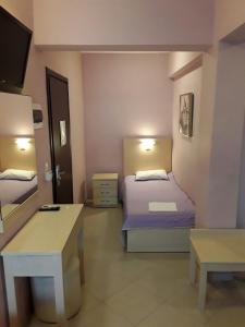 Posteľ alebo postele v izbe v ubytovaní Oniro Rooms & Suites