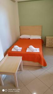 Posteľ alebo postele v izbe v ubytovaní Oniro Rooms & Suites