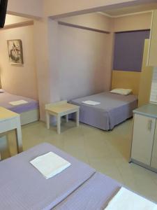 Posteľ alebo postele v izbe v ubytovaní Oniro Rooms & Suites