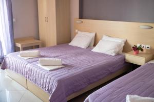 Posteľ alebo postele v izbe v ubytovaní Oniro Rooms & Suites