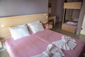 Posteľ alebo postele v izbe v ubytovaní Oniro Rooms & Suites