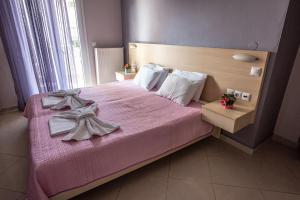 Posteľ alebo postele v izbe v ubytovaní Oniro Rooms & Suites