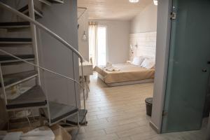 Posteľ alebo postele v izbe v ubytovaní Oniro Rooms & Suites
