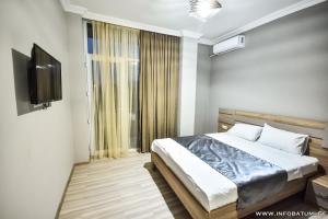 Postel nebo postele na pokoji v ubytování Hotel Wave