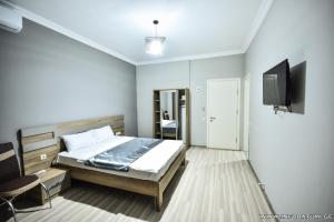 Postel nebo postele na pokoji v ubytování Hotel Wave + 37 fotografií