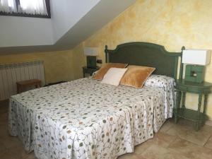Postel nebo postele na pokoji v ubytování Posada El Nozal