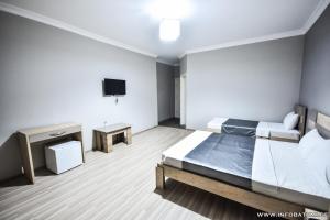 Postel nebo postele na pokoji v ubytování Hotel Wave