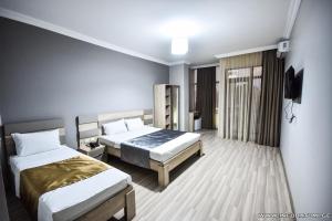 Postel nebo postele na pokoji v ubytování Hotel Wave