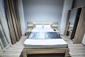 Postel nebo postele na pokoji v ubytování Hotel Wave